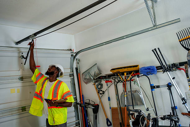 Professional Garage Door Roller Replacement technician working in Leslie, MI